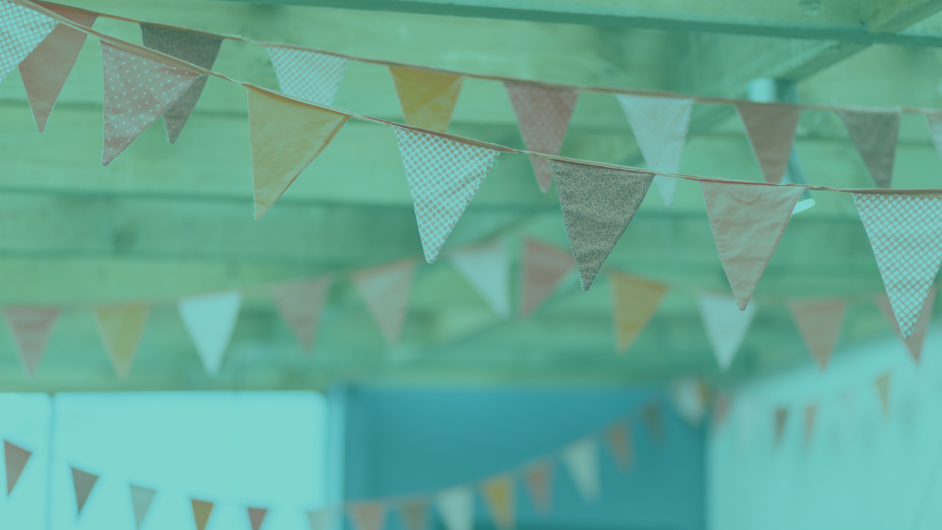 Image of bunting hanging from the ceiling with a blue filter over it